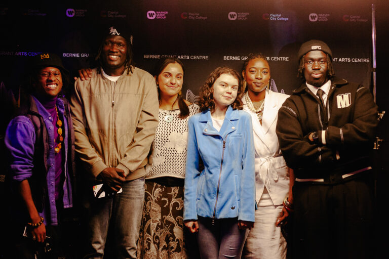 Solomon Adams with young people at the Bernie Grant Arts Centre after their Amplify showcase performance